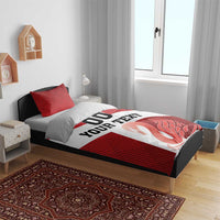 Red striped bedding set on bed with white banner “YOUR TEXT”, “00”, and swan print; duvet and pillows