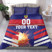 Blue and red football bedding on a bed with 00 graphic, stripes, and two pillowcases