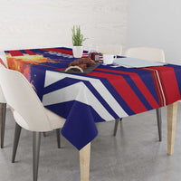 Blue and red striped tablecloth covering a dining table with folded corner drape