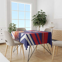 Blue and red striped tablecloth on a dining table with chairs around it