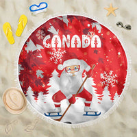 Red round beach blanket with “Canada” text, Santa, snowflakes, and white fringe border