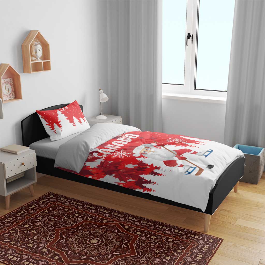 Red and white Christmas bedding set on bed with Santa hockey duvet and tree print pillows