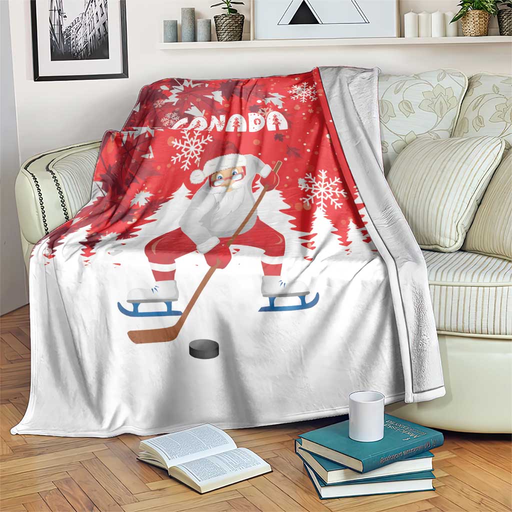 Red Christmas blanket draped over sofa, Santa hockey illustration with Canada and snowflakes