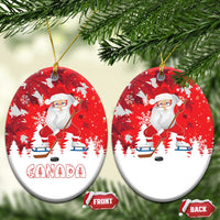 Red round ceramic Santa hockey Christmas ornaments with Canada graphic, front/back tags