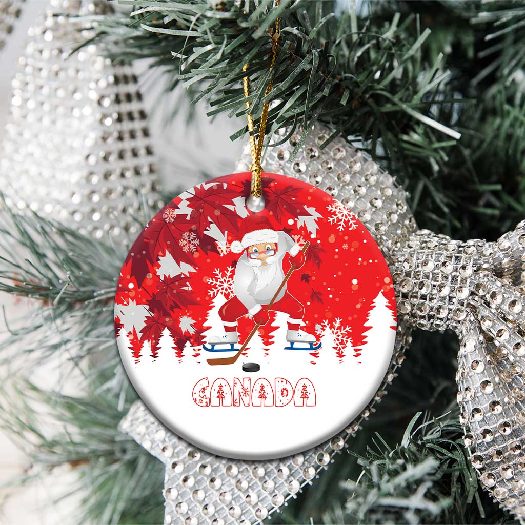 Red round ceramic Santa hockey Christmas ornament with Canada graphic on pine branches