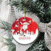 Red round ceramic Santa hockey Christmas ornament with Canada graphic on pine branches