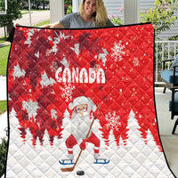 Red and white Canada-themed quilt with Santa on ice skates, trees, and snowflakes