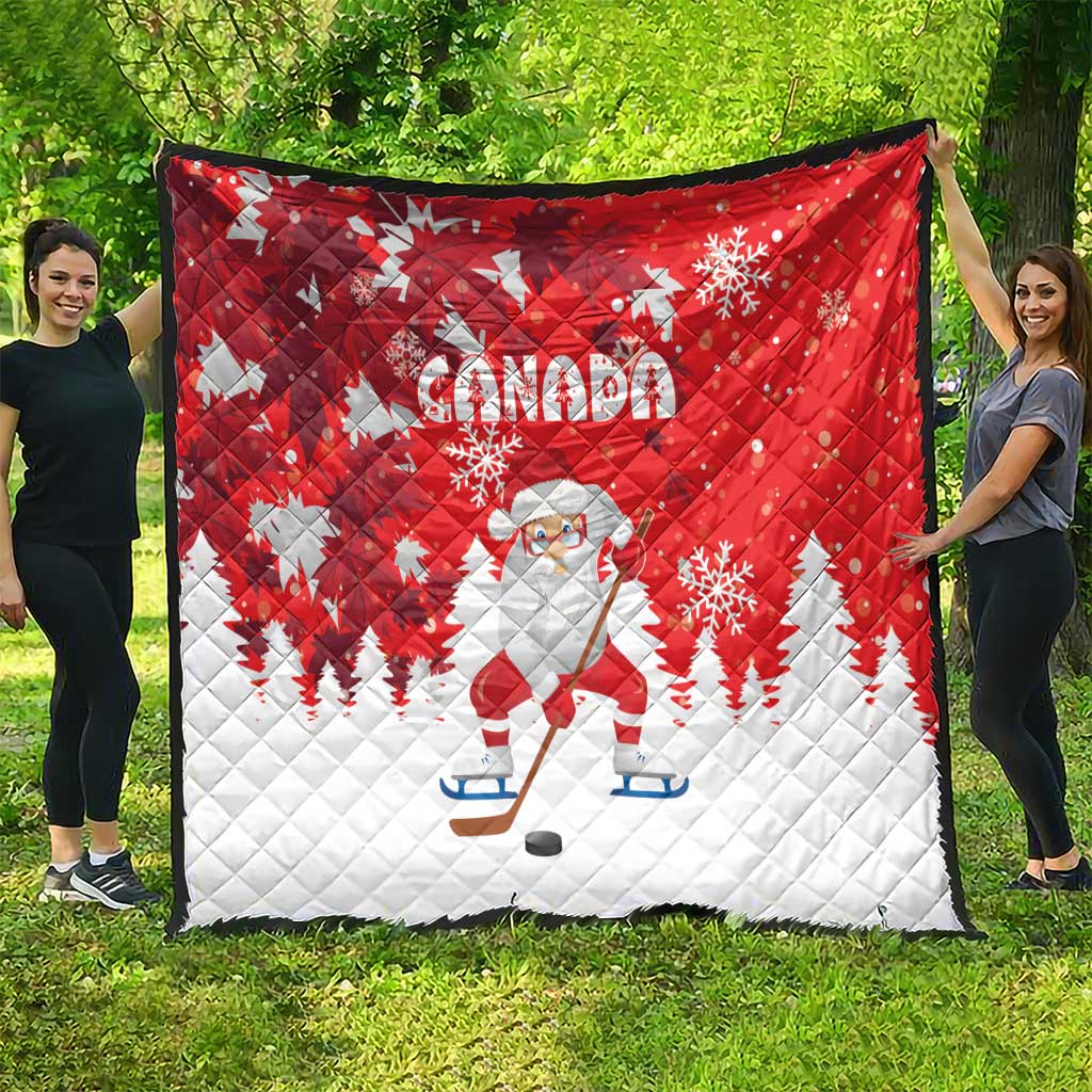 Red and white Canada Christmas quilt with Santa on skates, snowflakes, and pine trees