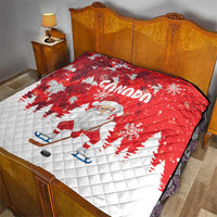 Red and white Santa and Canada quilt cover on a bed with a stitched diamond pattern