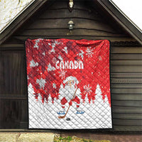 Red and white Canada quilt with Santa on ice skates, snowflakes, and pine tree shapes