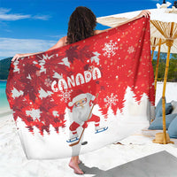 Red Christmas sarong close view with 'CANADA' Santa hockey and snowflake graphics