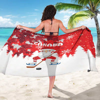Red Canada Christmas sarong back view with 'CANADA' text, Santa hockey and flakes