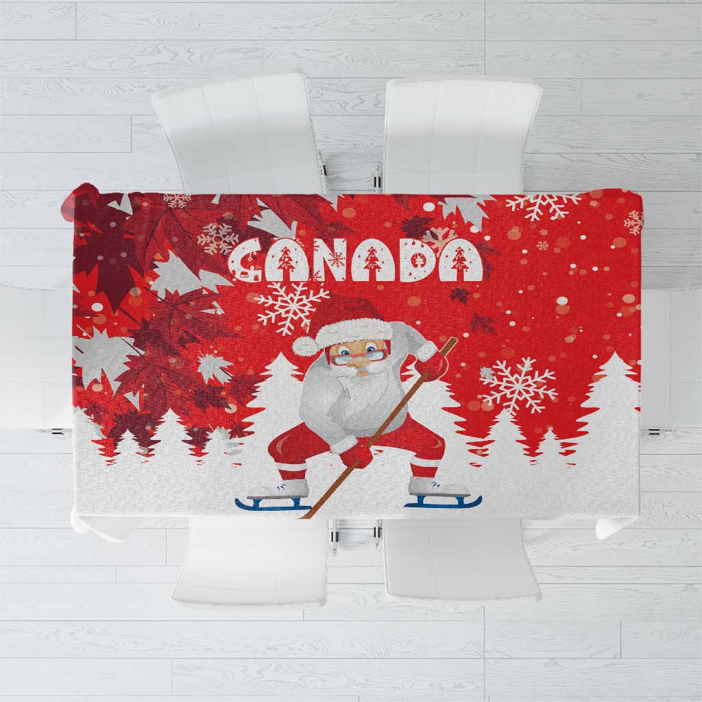 Red Christmas tablecloth with Canada text, Santa playing hockey, and snowflake prints