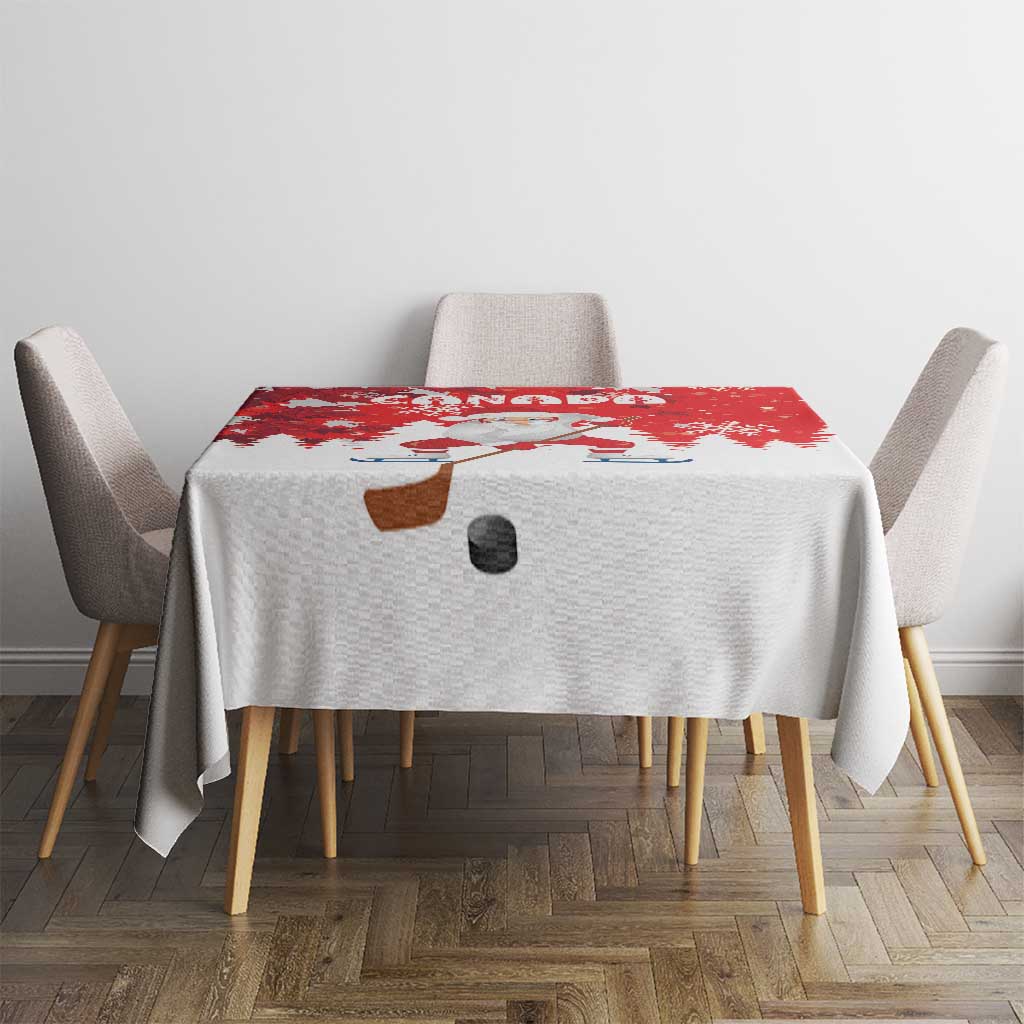 Red and white Christmas tablecloth with Santa hockey motif and scattered snow patterns