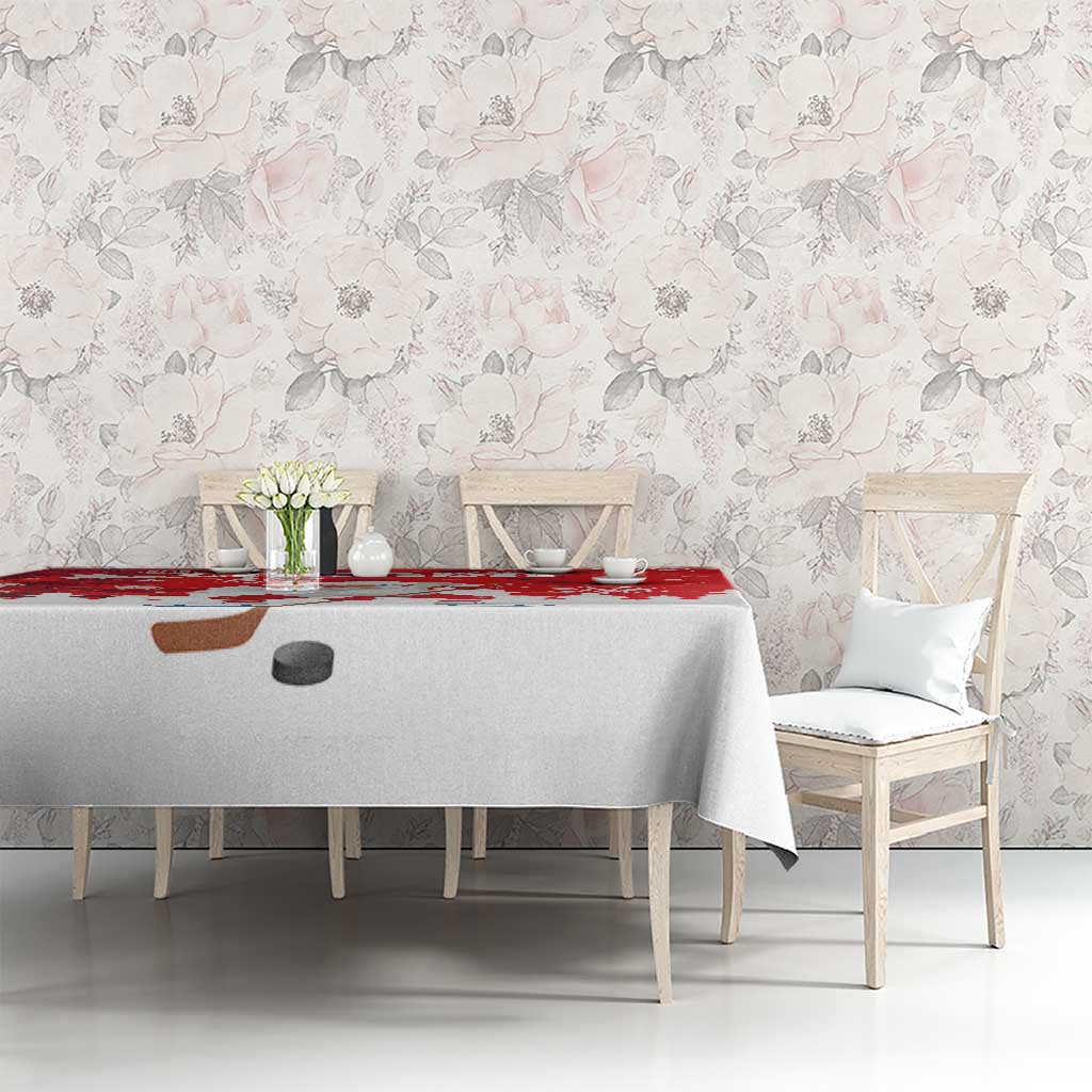 Red and white Christmas tablecloth with Santa hockey strip and snowflake accents