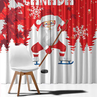 Close view of red and white holiday curtain fabric with Santa playing hockey