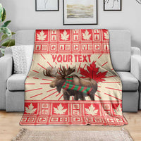 Personalized moose blanket draped on gray sofa, red plaid maple leaves and Your Text