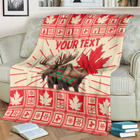 Personalized moose blanket on couch with red plaid maple leaves and Your Text center