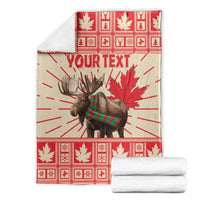 Personalized moose blanket with red plaid maple leaves, Your Text, and white folded towels