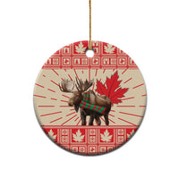Round ceramic moose ornament with red-and-white maple leaf pattern, gold hanging string