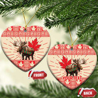 Heart-shaped ceramic moose ornament set with red maple leaf print, gold hanging string, front/back tags