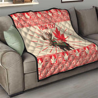 Personalized moose quilt blanket draped on sofa in red and cream with maple leaf and YOUR TEXT