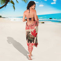 Red and cream moose sarong draped around ankles with maple leaf rays print