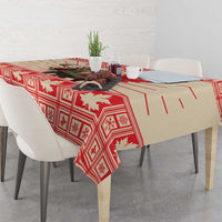 Red Christmas tablecloth with moose centerpiece and maple leaf motif