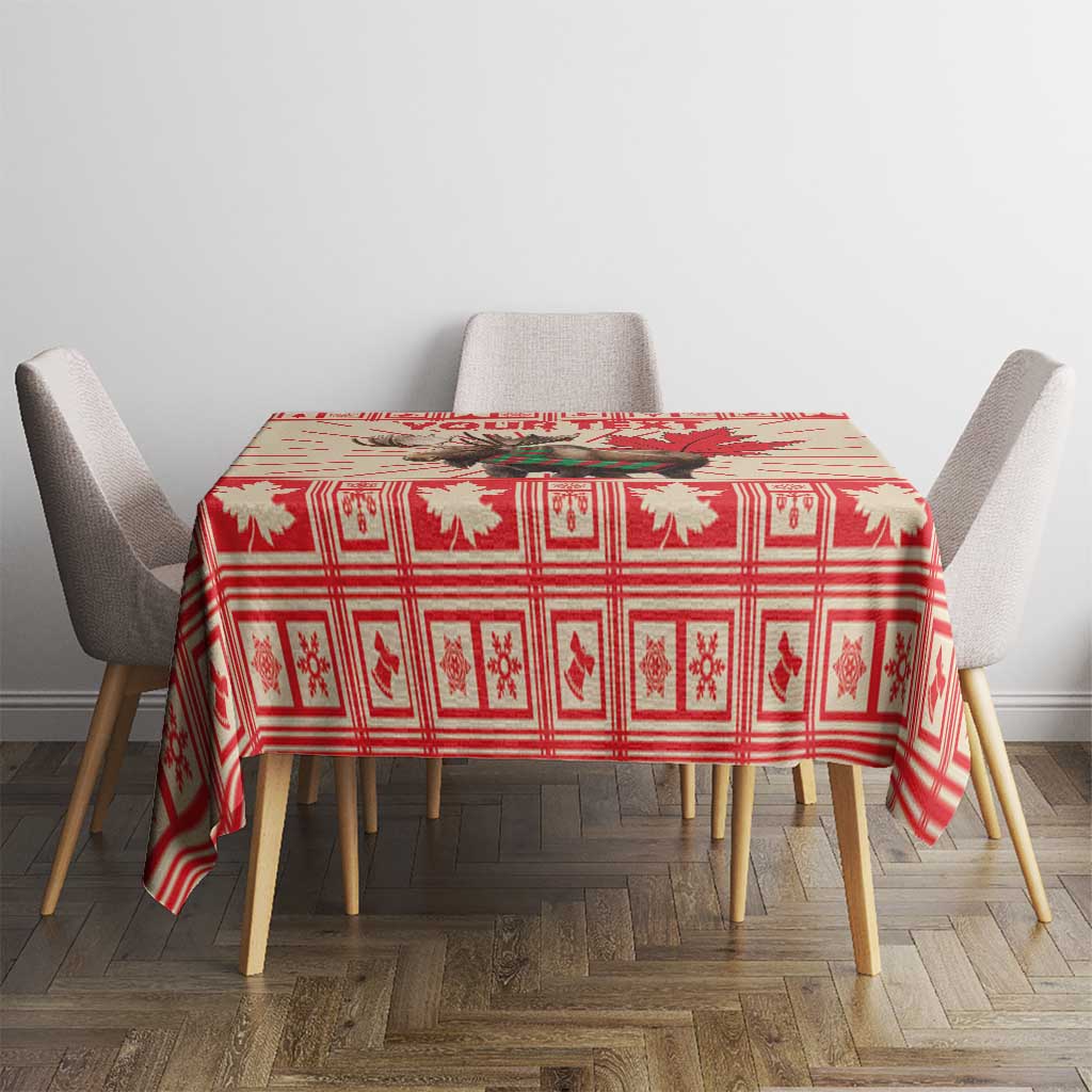 Red Christmas tablecloth on dining table with maple leaf and moose prints