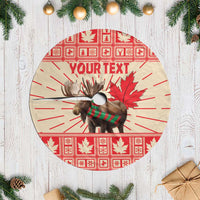 Red round Christmas tree skirt with moose, maple leaf design, and custom text