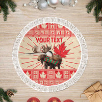 Red round Christmas tree skirt with moose and maple leaf graphic, white fringe edge