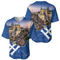 Pair of blue baseball jerseys with eagle and castle graphics, button-front, short sleeves.