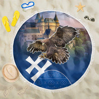 Round beach blanket in dark blue with eagle graphic and fringed edge