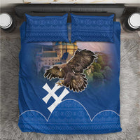 Blue eagle-and-castle bedding set with two matching pillow shams and patterned trim