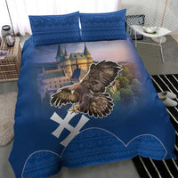Blue bedding set with eagle wing graphic, castle landscape, and two blue patterned pillow covers