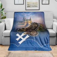 Blue throw blanket featuring castle and large eagle, white cross shapes on patterned base