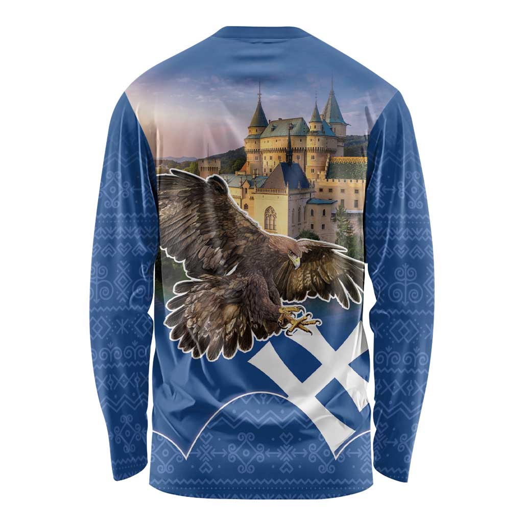 Blue long-sleeve shirt back with eagle wings graphic, castle backdrop, and Slovak pattern