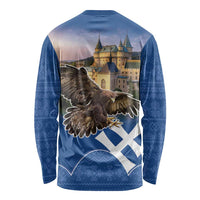 Blue long-sleeve shirt back with eagle wings graphic, castle backdrop, and Slovak pattern