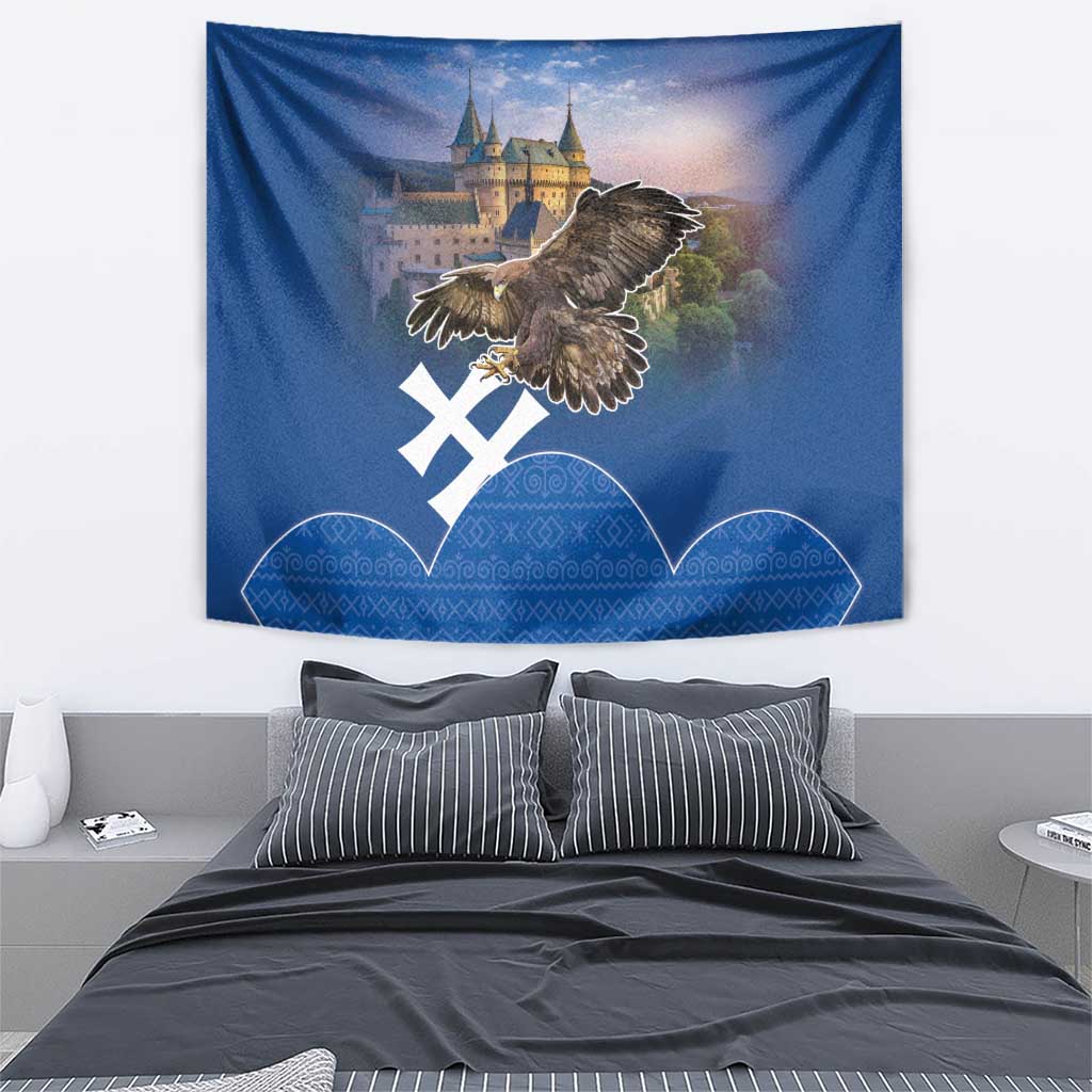 Blue wall tapestry with eagle and castle artwork plus white cross and blue geometric band