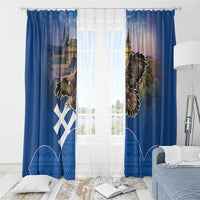 Blue window curtain panels with eagle and castle print, hung with top grommets