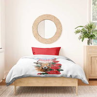 White bedding set with red rose and chamois graphic, blue geometric detail, no visible pillowcases