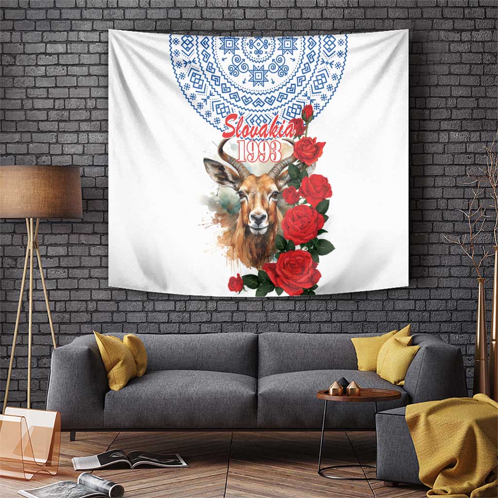 White wall tapestry with deer portrait, red roses, and blue geometric border design