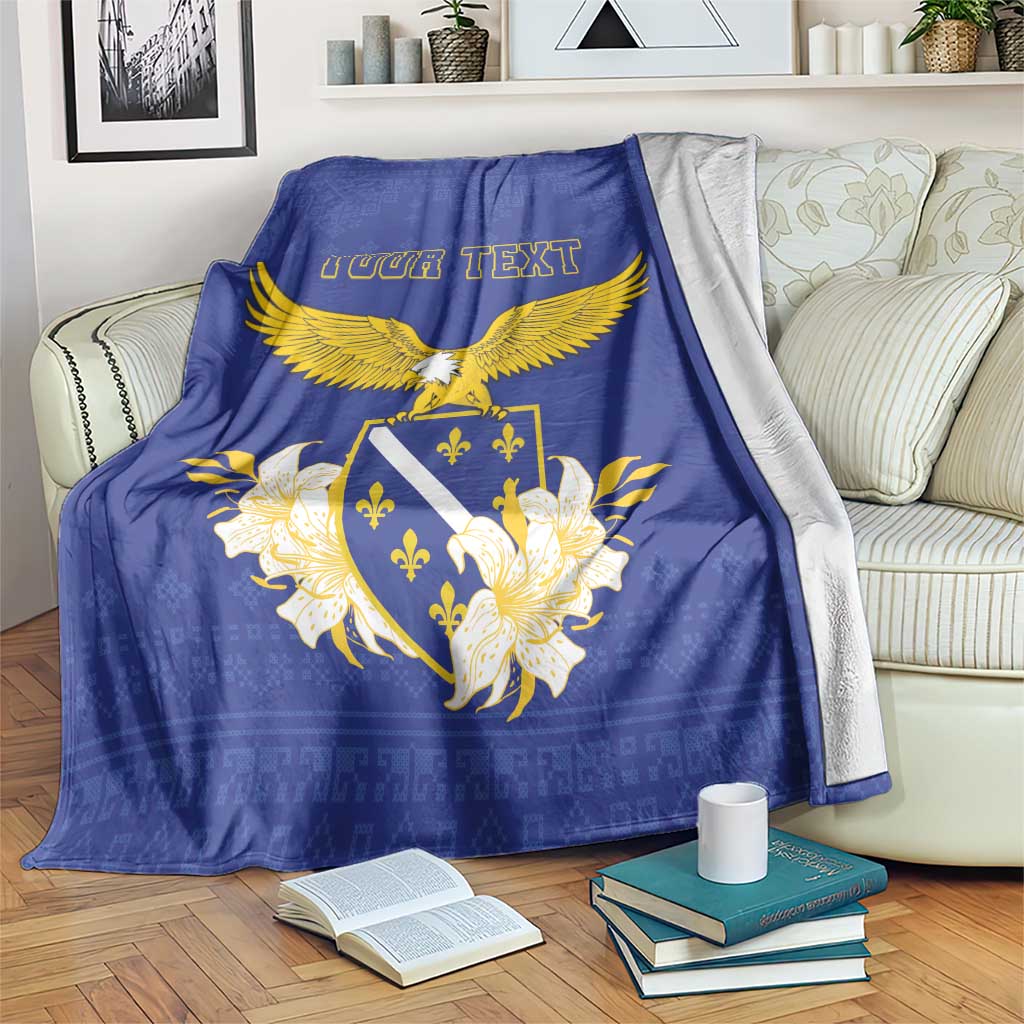 Blue personalized blanket draped on couch, golden eagle and lilium with 'YOUR TEXT'.