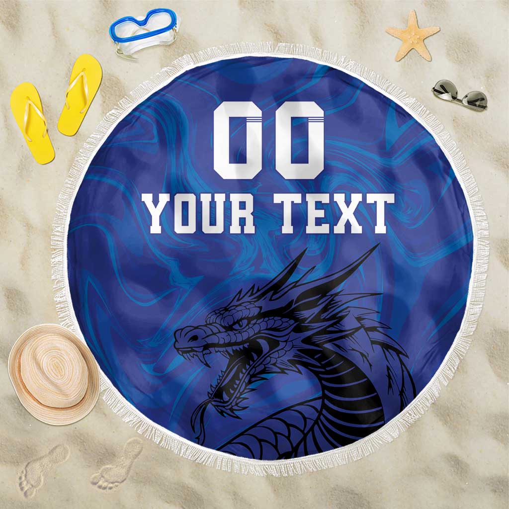 Blue round beach blanket with fringe, "00 YOUR TEXT" and centered dragon design