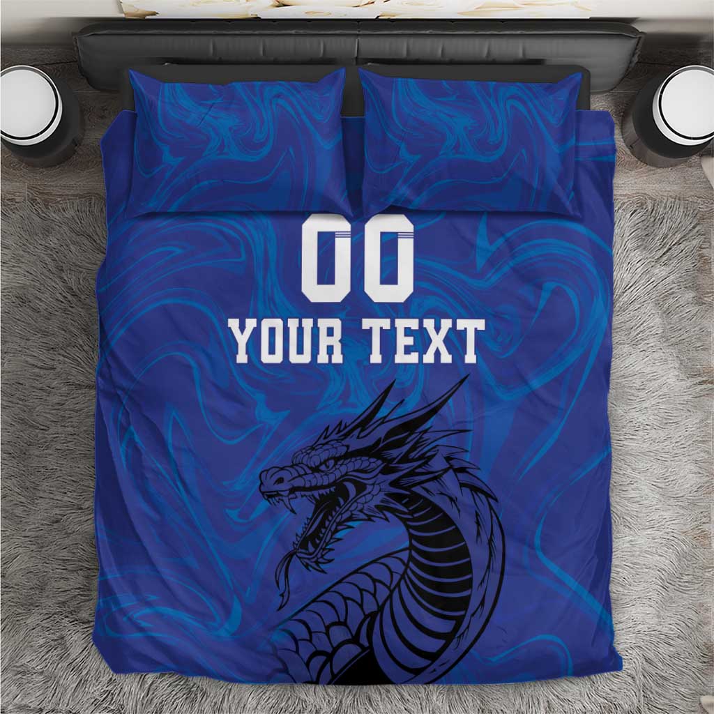 Blue duvet set with dragon graphic, "YOUR TEXT" and "00" on front, two pillows