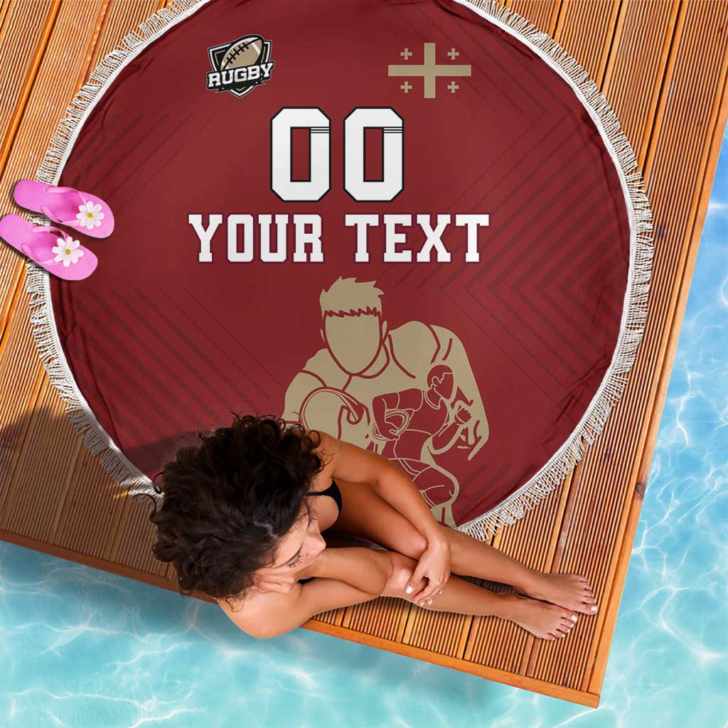 Round red rugby beach blanket with fringe, Rugby logo, 00, and custom 'YOUR TEXT'.