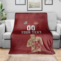 Red custom rugby blanket on sofa with YOUR TEXT, 00, and rugby player illustration