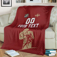 Red custom rugby blanket on armchair with YOUR TEXT, 00, and player graphic