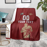 Red custom rugby blanket on couch with YOUR TEXT, 00, and player illustration