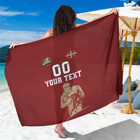 Red rugby sarong with geometric stripe pattern and '00 YOUR TEXT' graphic on front